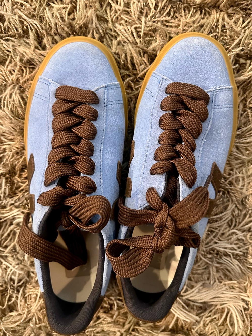 Veja sneakers in light blue suede with brown accents and gum sole. Size 9